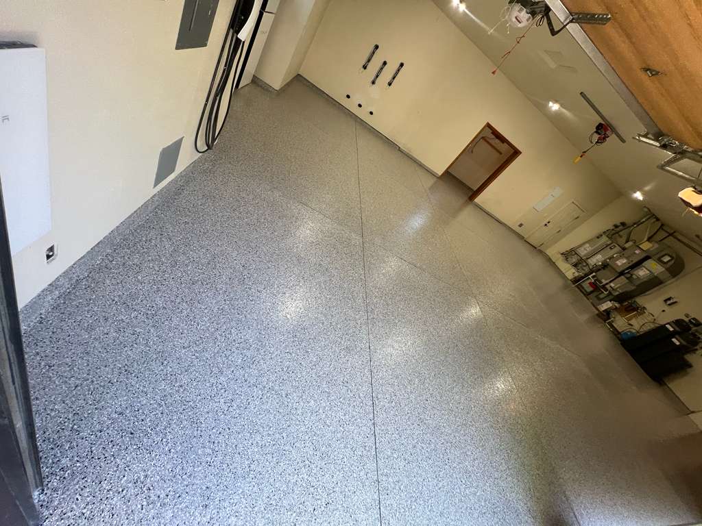 Same Boise garage after — gray & black flake epoxy coating with polyaspartic topcoat